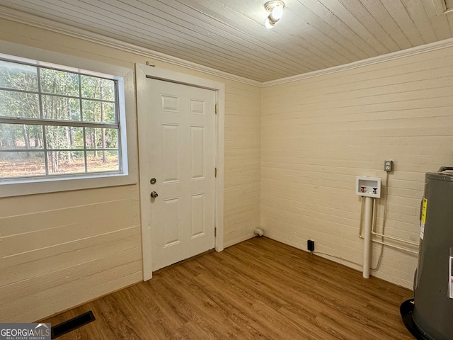 foyer entrance with water heater, wood ceiling, crown molding, and hardwood / wood-style floors