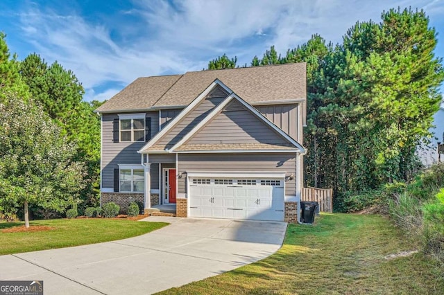 view of front of home with a front lawn and a garage