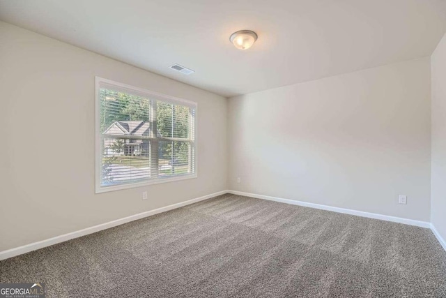 empty room featuring carpet flooring