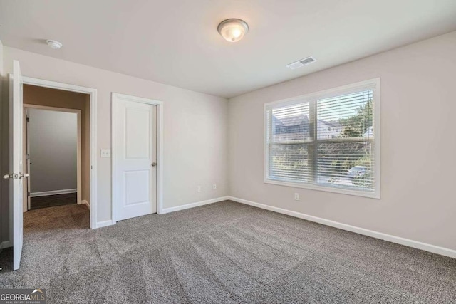 unfurnished bedroom featuring carpet flooring