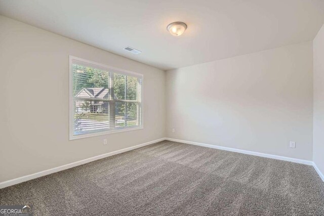 unfurnished room with carpet floors