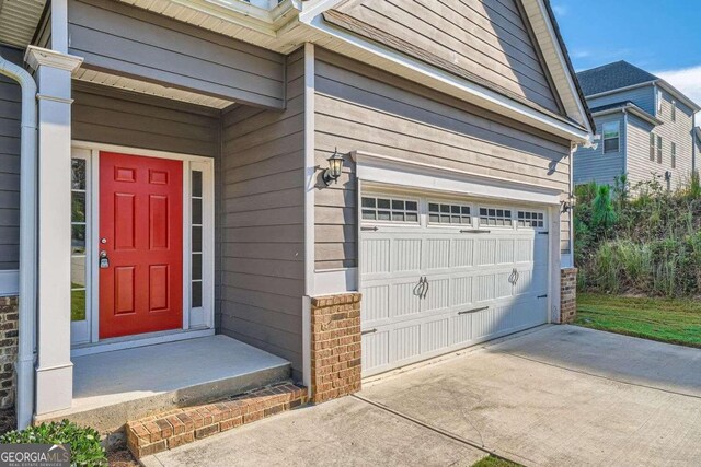 property entrance featuring a garage