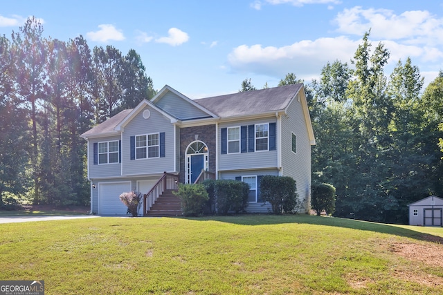 split foyer home featuring a front yard and a garage