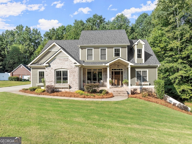 view of front of house featuring a porch and a front lawn