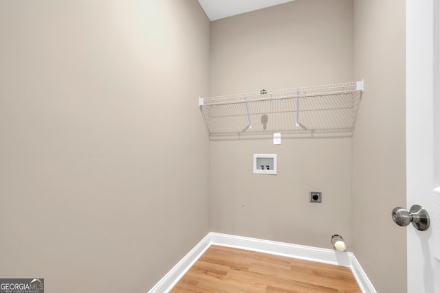 washroom featuring wood-type flooring, hookup for an electric dryer, and hookup for a washing machine