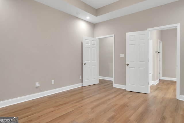 unfurnished room with light wood-type flooring