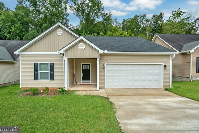 ranch-style home featuring a garage and a front lawn