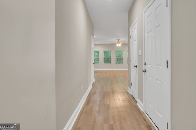 hall with light hardwood / wood-style floors