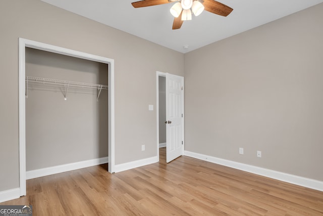 unfurnished bedroom featuring a closet, light wood-type flooring, and ceiling fan