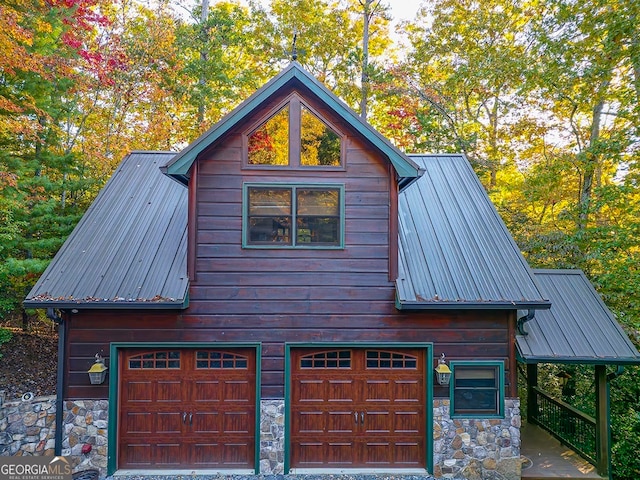 view of side of property featuring a garage