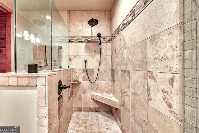 bathroom featuring a tile shower