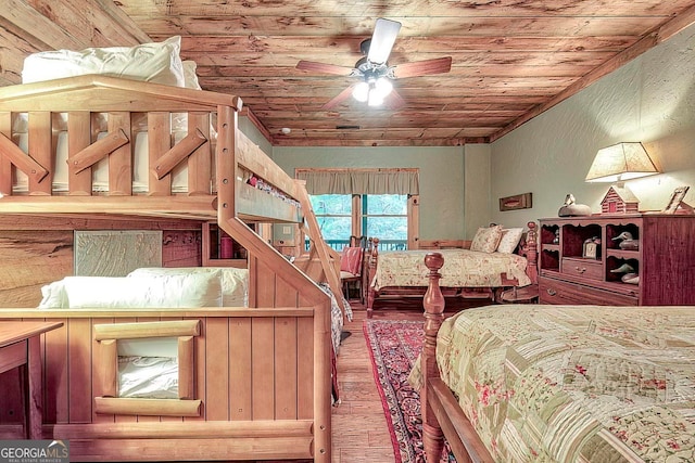 bedroom with wooden ceiling, hardwood / wood-style flooring, and ceiling fan