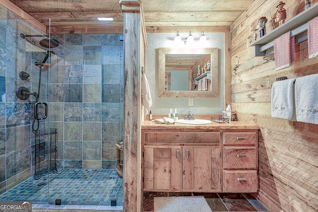 bathroom featuring walk in shower, wood walls, and vanity