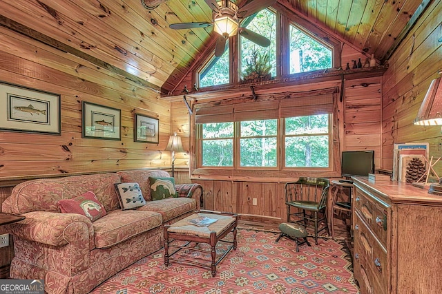 living room featuring wooden ceiling, ceiling fan, wooden walls, and high vaulted ceiling