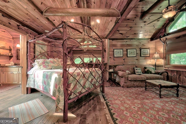 bedroom with wood walls, multiple windows, wood-type flooring, and wood ceiling