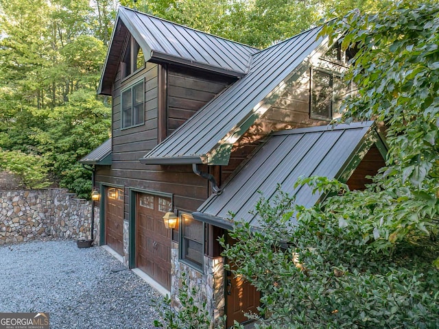 view of side of property with a garage