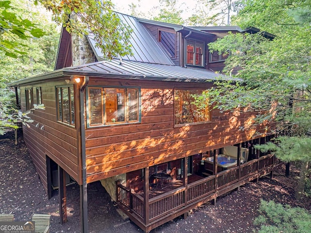 view of side of property with a wooden deck