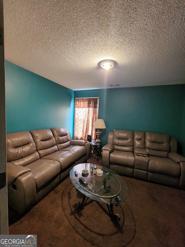 living room with carpet floors and a textured ceiling