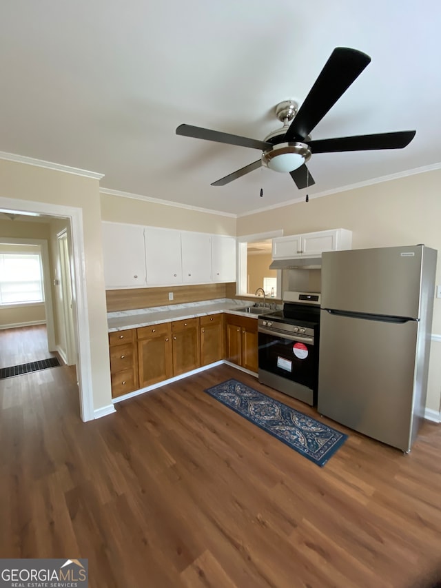 kitchen with white cabinets, ceiling fan, appliances with stainless steel finishes, and dark hardwood / wood-style flooring