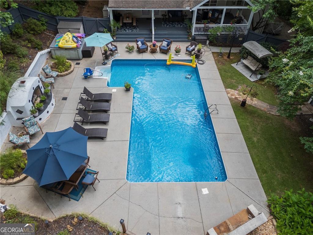 view of swimming pool featuring a patio area