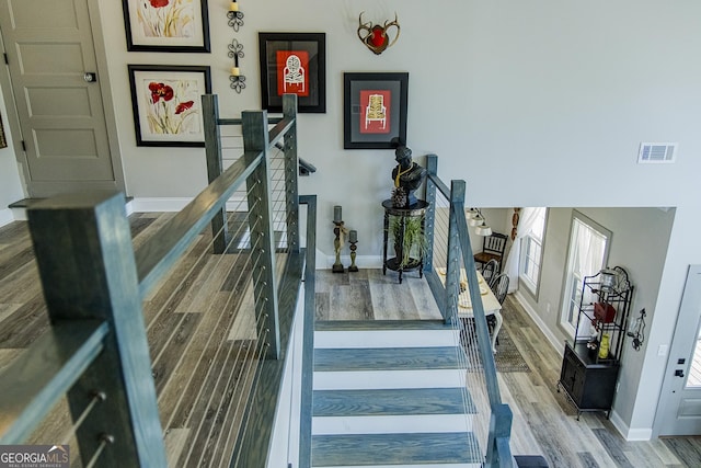 stairs with wood-type flooring