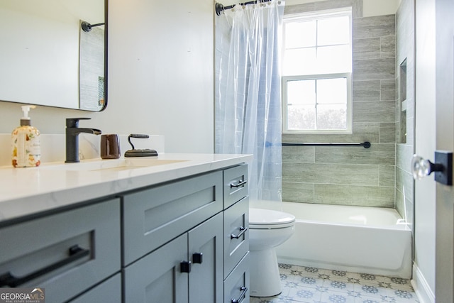 full bathroom featuring vanity, shower / bath combination with curtain, and toilet