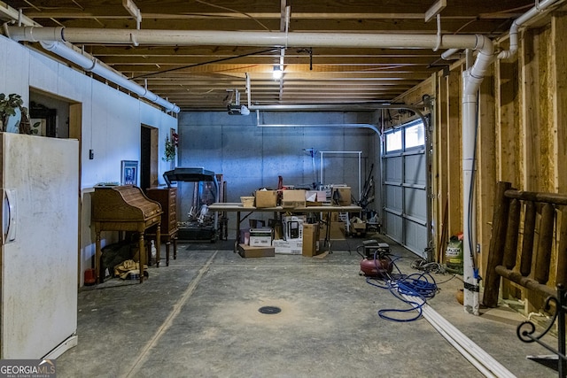 basement with white fridge