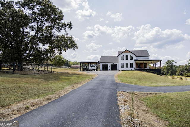 view of front of house with a front lawn and a carport