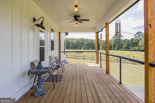 deck featuring covered porch and ceiling fan