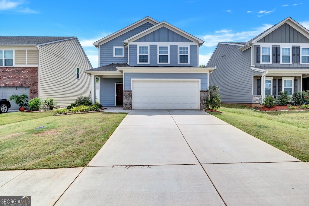 craftsman-style house with a front yard and a garage