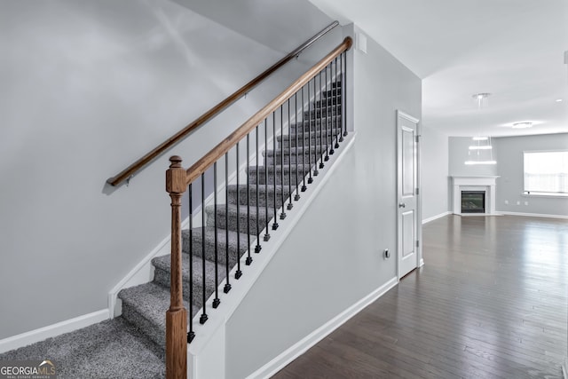 stairs featuring wood-type flooring