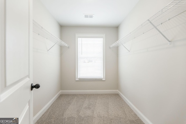 walk in closet with carpet and visible vents