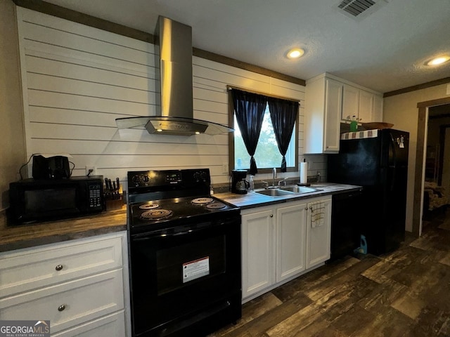 kitchen with ventilation hood, white cabinets, sink, and black appliances