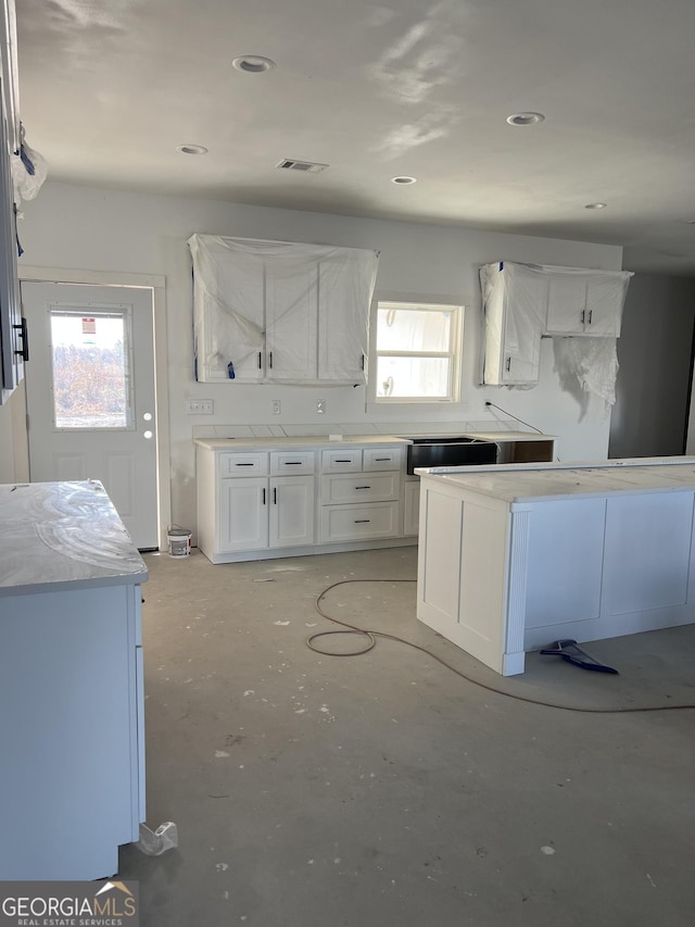 kitchen featuring white cabinetry