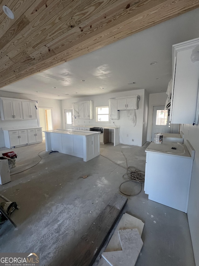 kitchen with white cabinets and a center island