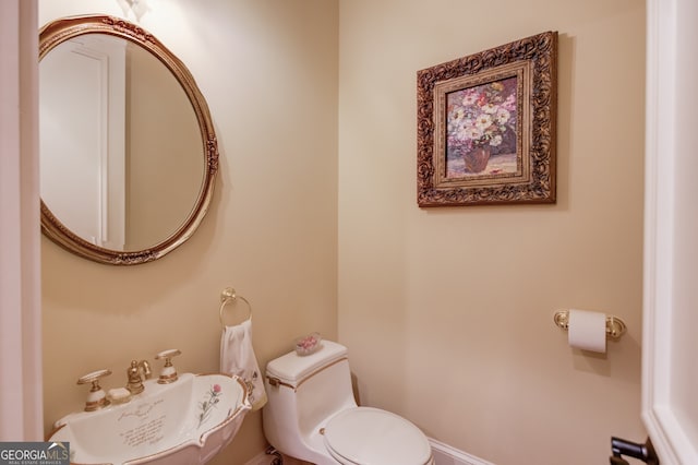 bathroom with sink and toilet