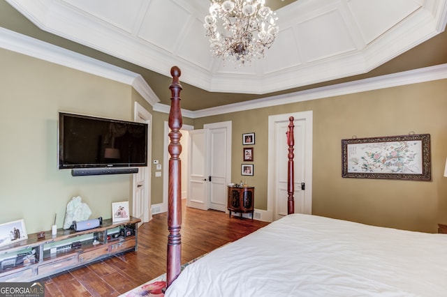 bedroom featuring ornamental molding, a chandelier, coffered ceiling, and dark hardwood / wood-style flooring