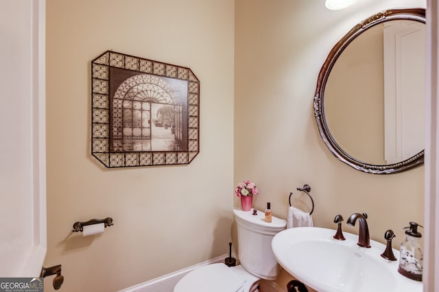 bathroom with toilet and sink