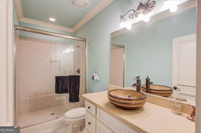 bathroom featuring tile patterned flooring, vanity, toilet, and a shower with door