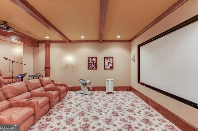 home theater with carpet floors, beamed ceiling, and ornamental molding