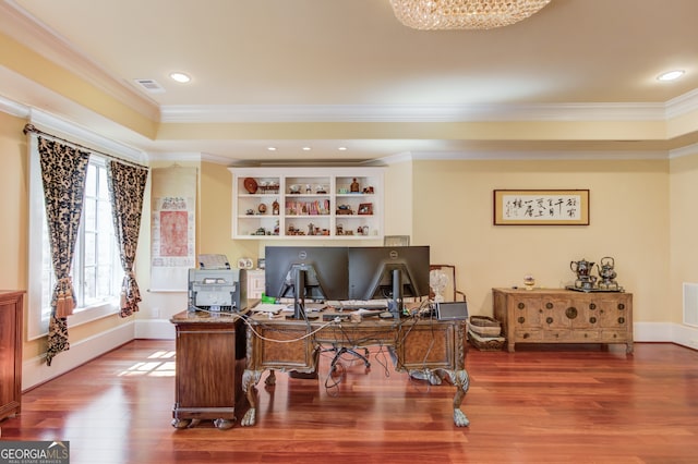 home office featuring crown molding and hardwood / wood-style flooring