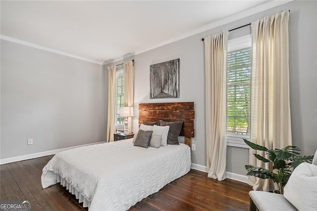 bedroom featuring dark hardwood / wood-style flooring, multiple windows, and ornamental molding