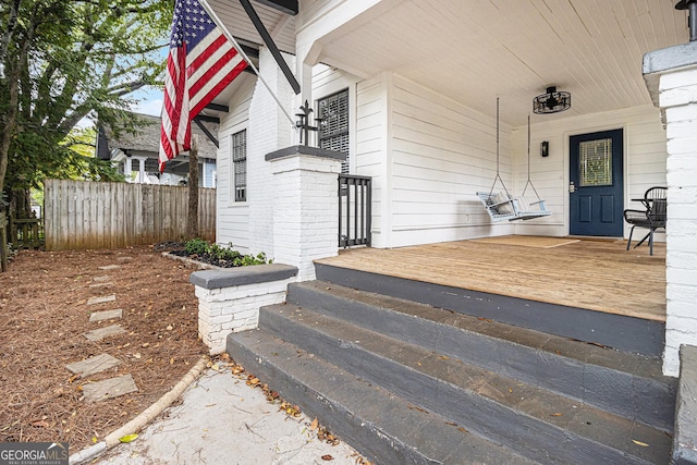 property entrance with covered porch