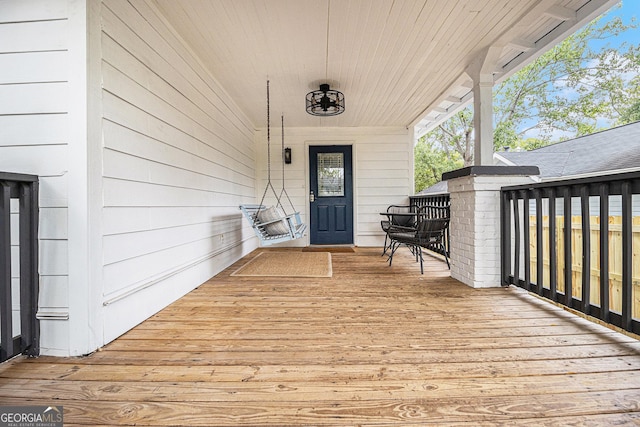 wooden deck featuring covered porch