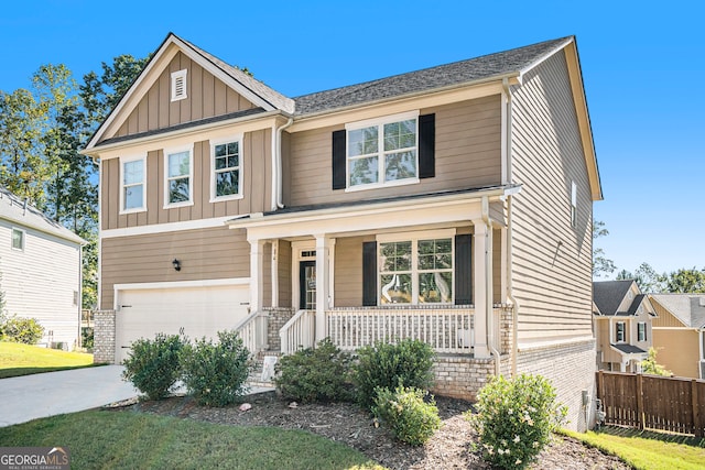 craftsman inspired home with a porch and a garage