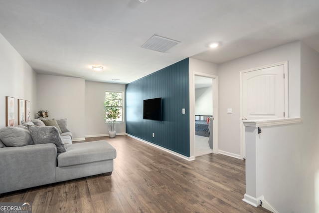 living room with dark hardwood / wood-style floors