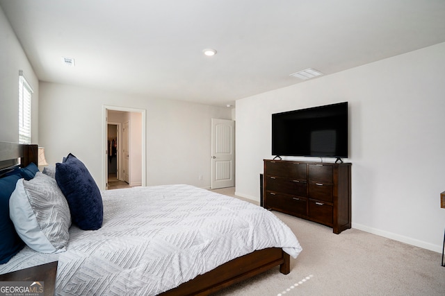 bedroom with light colored carpet