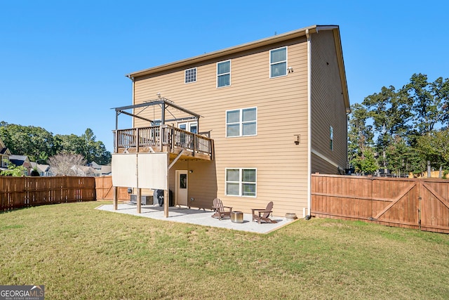 back of house with a yard and a patio area