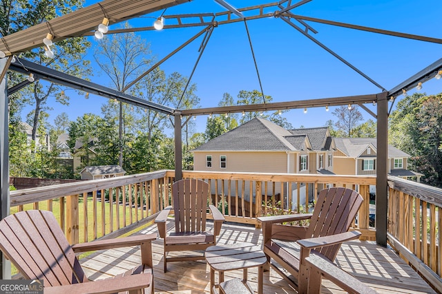 wooden terrace with a storage shed