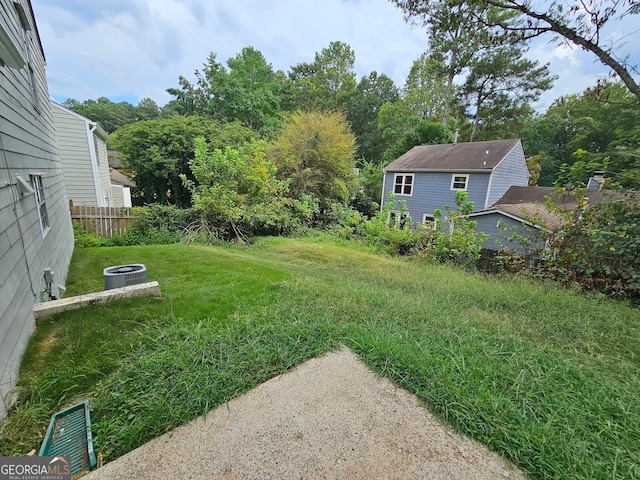 view of yard with central AC unit